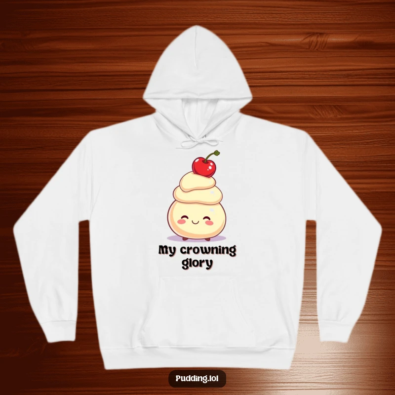 Funny Hoodie: A smiling pudding character balances a cherry on its head, bringing cozy charm and a sense of playful skill.